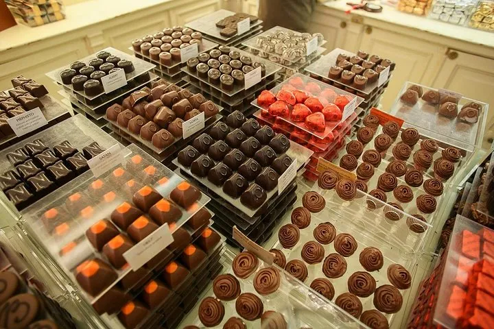 Small group tasting pralines in a shop on a small group chocolate tour in Brussels