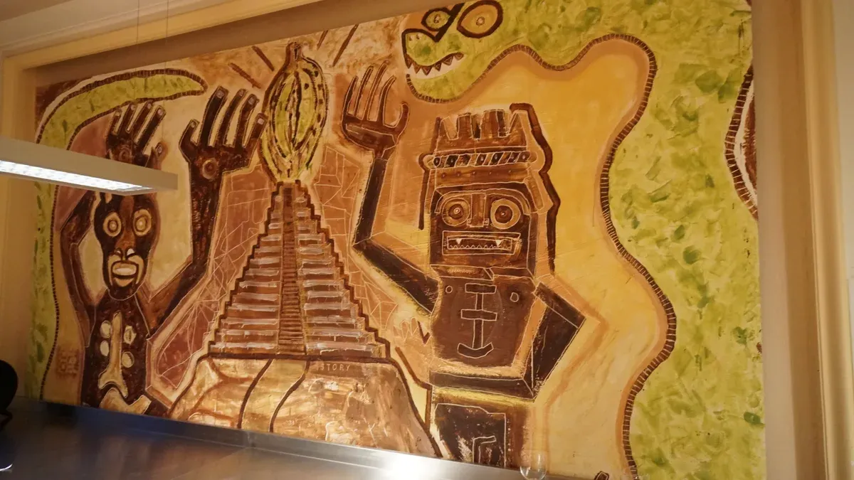 A cacao mural inside the Choco-Story chocolate museum on Rue de l'Etuve, part of chocolate tours in Brussels