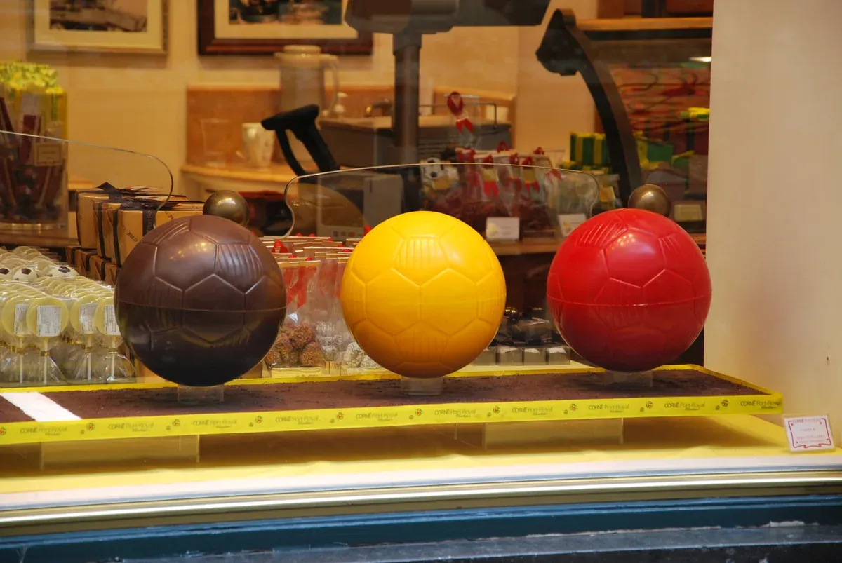 Chocolate footballs in a Brussels shop window, a common sight on chocolate tours in Brussels