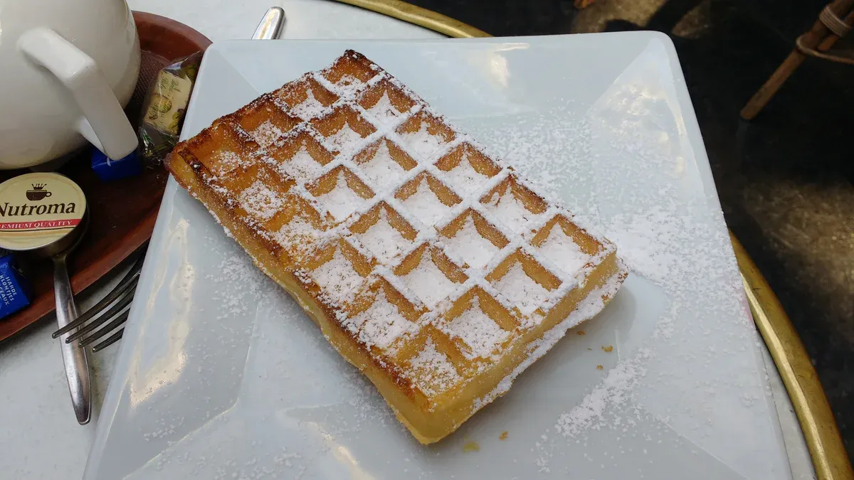 Brussels waffle with powdered sugar served in central Brussels, a snack stop on chocolate tours in Brussels